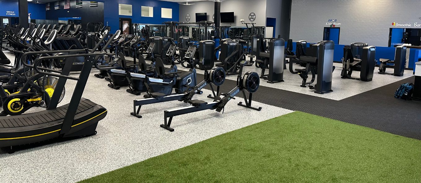 Cardio machines, rowing equipment, and functional training turf at Epic Health & Fitness in Port Richey, Florida