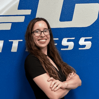 Female personal trainer at Epic Health and Fitness, NASM certified and InBody certified, specializing in strength training, glute development, mobility, and injury prevention.